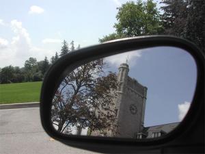 Picture of Johnston Hall in reflection of side view mirror